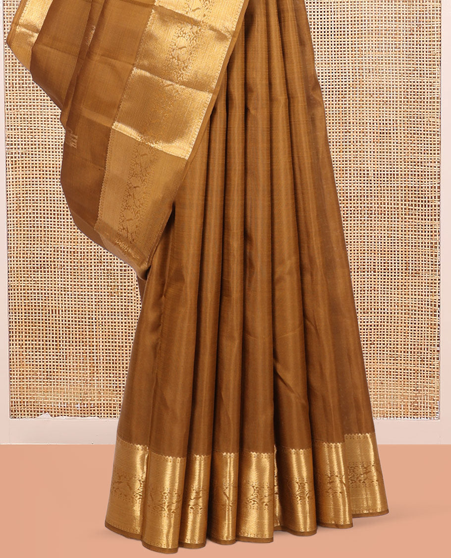 Brown Kanchipuram Silk Saree, Adorned with Yaanai Buttas, Highlighted by Zari Border of Rekku, Poun, Mayil, and Mayil Kann, Zari Design Pallu, and Matching Blouse