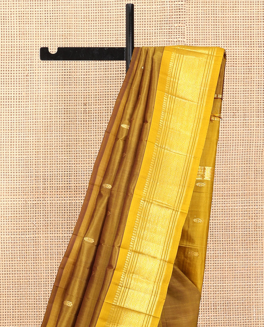 Green Kanchipuram Silk Saree, Elevated with Zari Buttas, a Contrast One-Sided Border of Paneer Sombu, Banaras, Muthu, and Jaal Designs, a Zari Design Pallu, and No Blouse