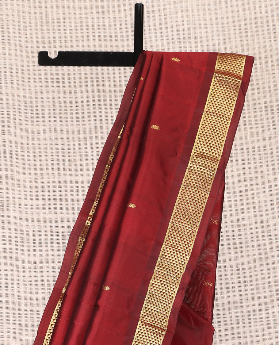 Red Kanchipuram Silk Saree, Adorned with Zari Buttas, Complemented by a Semi-Contrast Ara Madam Border, Pallu of Zari Design, and Matching Blouse