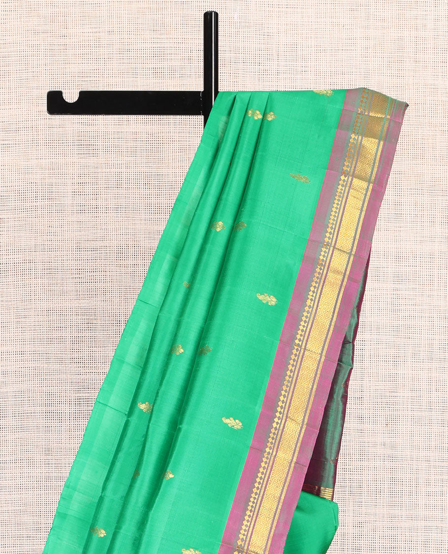 Green Kanchipuram Silk Saree, Woven with Zari Buttas, a Contrast One-Sided Border of Panner Sombu, Banaras, and Mayil Kann Designs, Zari Design Pallu, and No Blouse