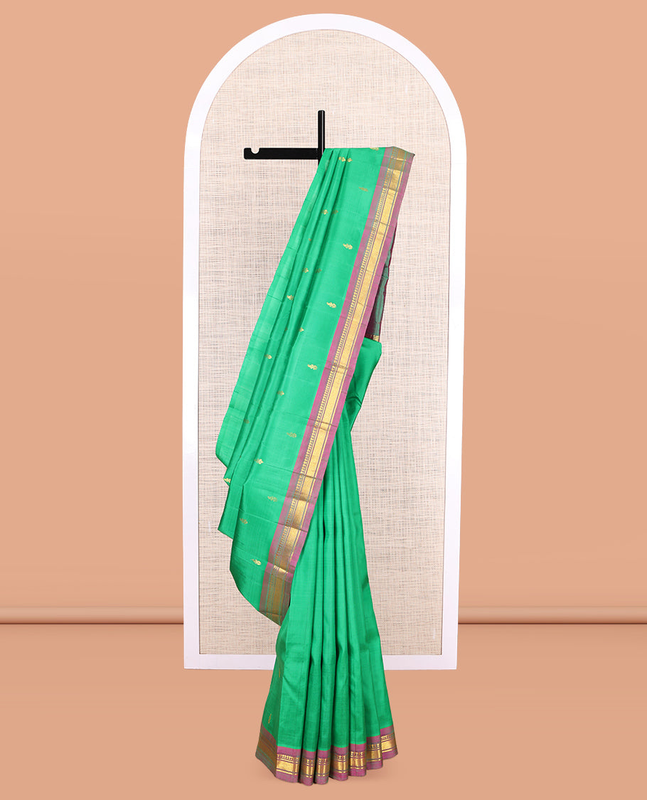 Green Kanchipuram Silk Saree, Woven with Zari Buttas, a Contrast One-Sided Border of Panner Sombu, Banaras, and Mayil Kann Designs, Zari Design Pallu, and No Blouse