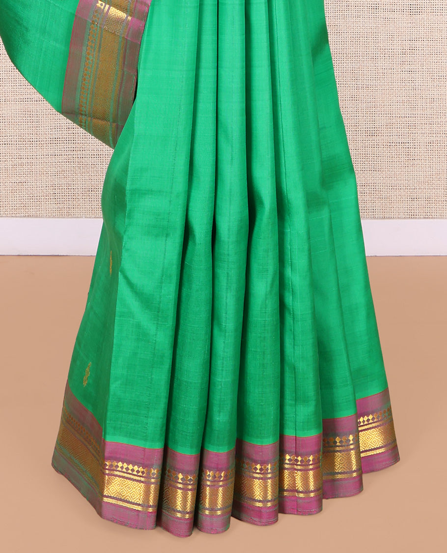 Green Kanchipuram Silk Saree, Woven with Zari Buttas, a Contrast One-Sided Border of Panner Sombu, Banaras, and Mayil Kann Designs, Zari Design Pallu, and No Blouse