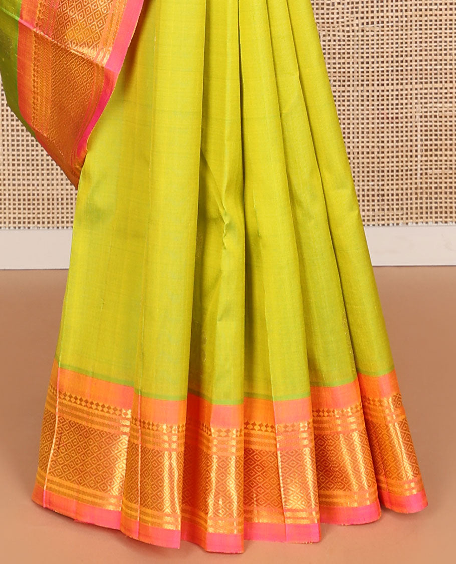 Light green buttas kancheepuram silk saree with contrast border of thilakam moku, banaras, kuyil kann design & zari design pallu