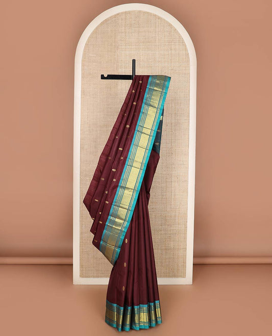 Maroon zari buttas silk saree, contrast one-sided border of panner sombu,banaras,muthu & mayil kann designs & zari design pallu