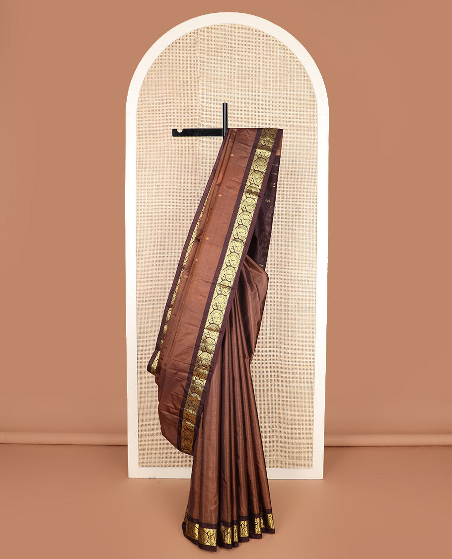 Brown zari buttas Kanchipuram silk saree, contrast mayil enclosed manga zari border, and zari design pallu