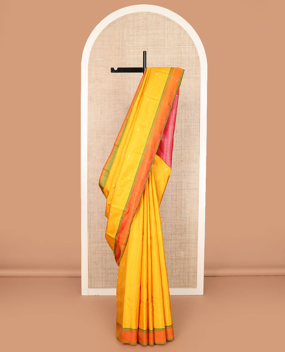 Yellow buttas Kanchipuram silk saree, contrast border of malli mokku designs, and pallu of geometric designs