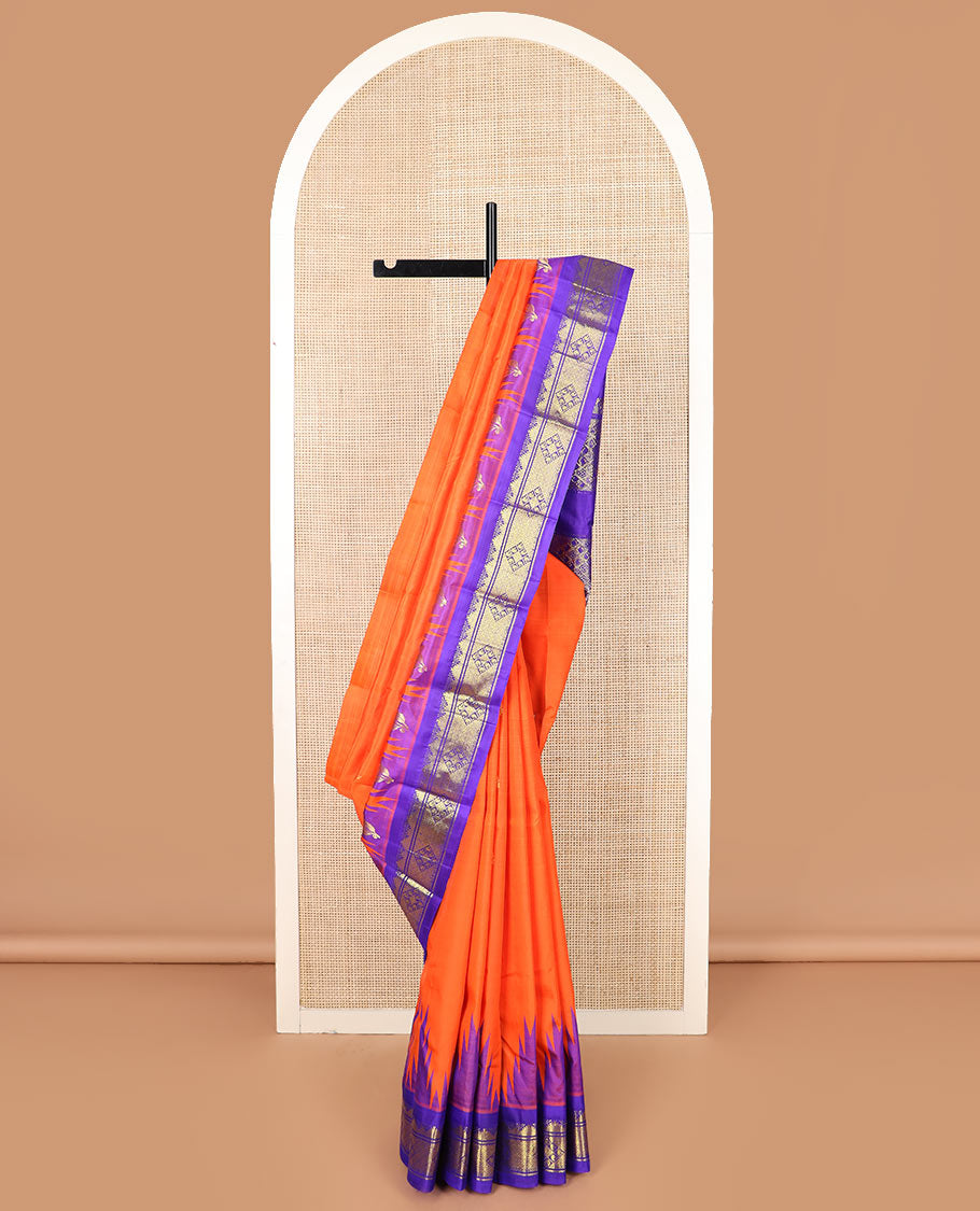 Orange zari buttas Kanchipuram silk saree, contrast thazampoo rekku border, and pallu of intricate zari designs