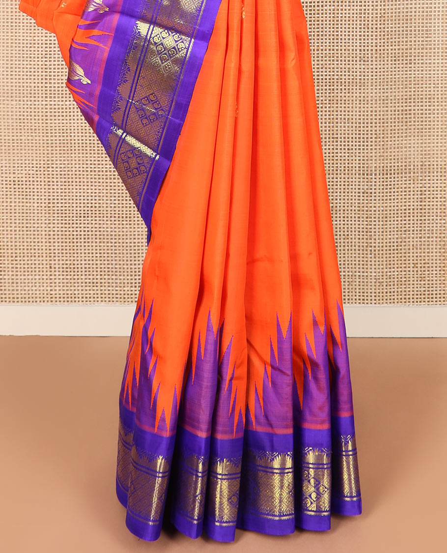 Orange zari buttas Kanchipuram silk saree, contrast thazampoo rekku border, and pallu of intricate zari designs