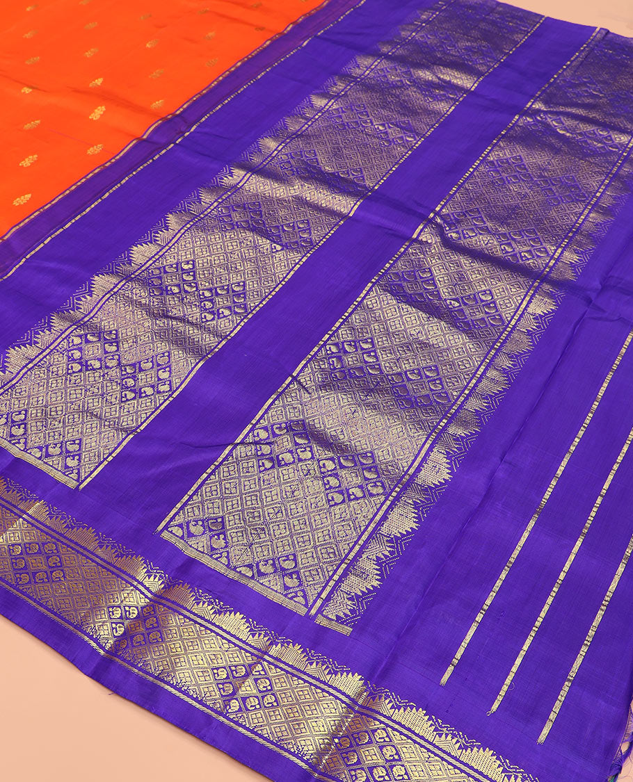 Orange zari buttas Kanchipuram silk saree, contrast thazampoo rekku border, and pallu of intricate zari designs