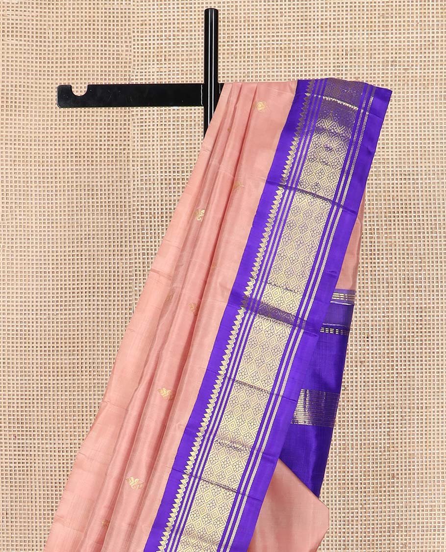 Peach zari buttas Kanchipuram silk saree, contrast one-sided korvai border of thilakam mokku, banaras, and jaal designs, and zari design pallu