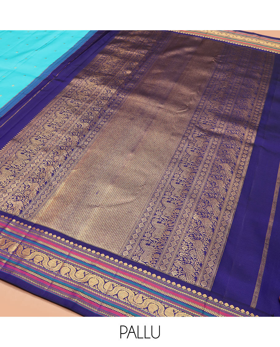 Blue zari buttas Kanchipuram silk saree, contrast border of thilakam mokku, banaras, kathir, and dhavana manga designs, and mayil kann design pallu
