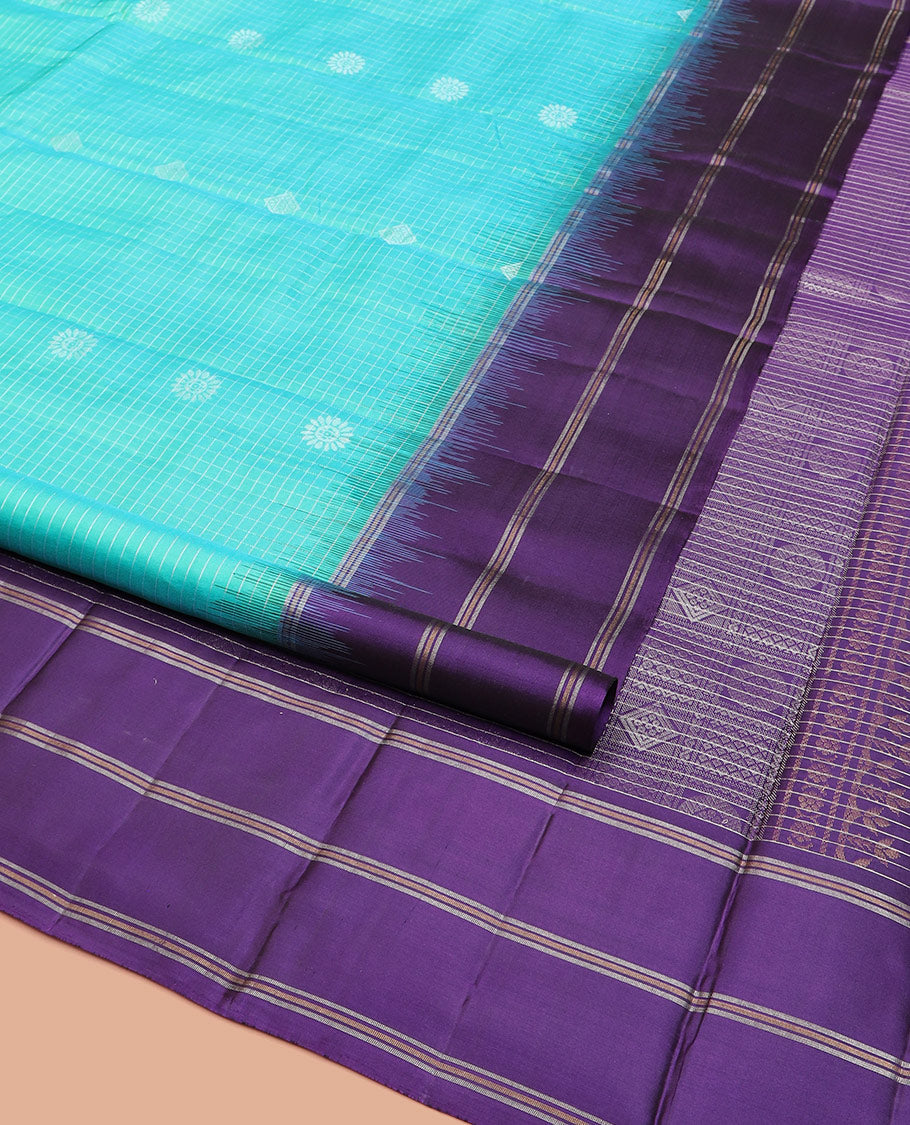 Blue Kanchipuram Silk Saree Elevated with Buttas and Checks All Over Its Body, Complemented by a Contrast Border of Stripes, Featuring Pallu of Intricate Designs, and Paired with a Contrast Blouse