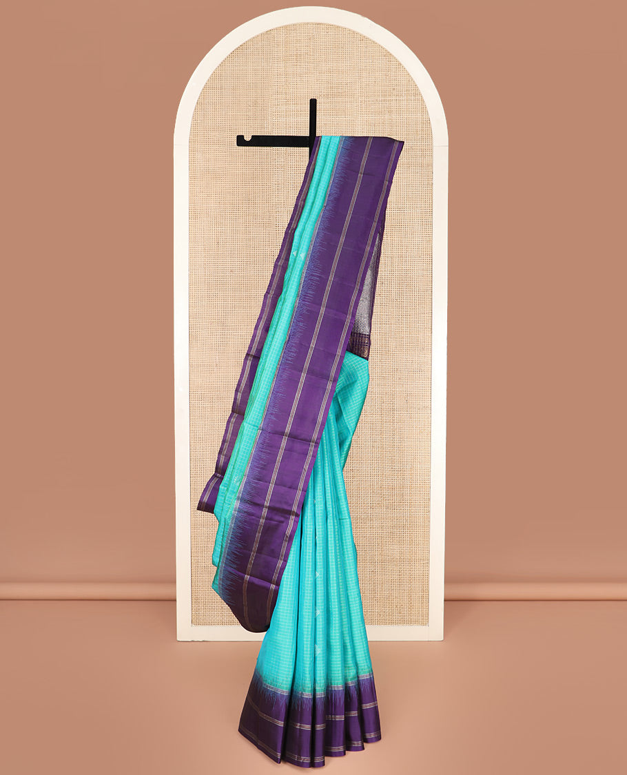 Blue Kanchipuram Silk Saree Elevated with Buttas and Checks All Over Its Body, Complemented by a Contrast Border of Stripes, Featuring Pallu of Intricate Designs, and Paired with a Contrast Blouse