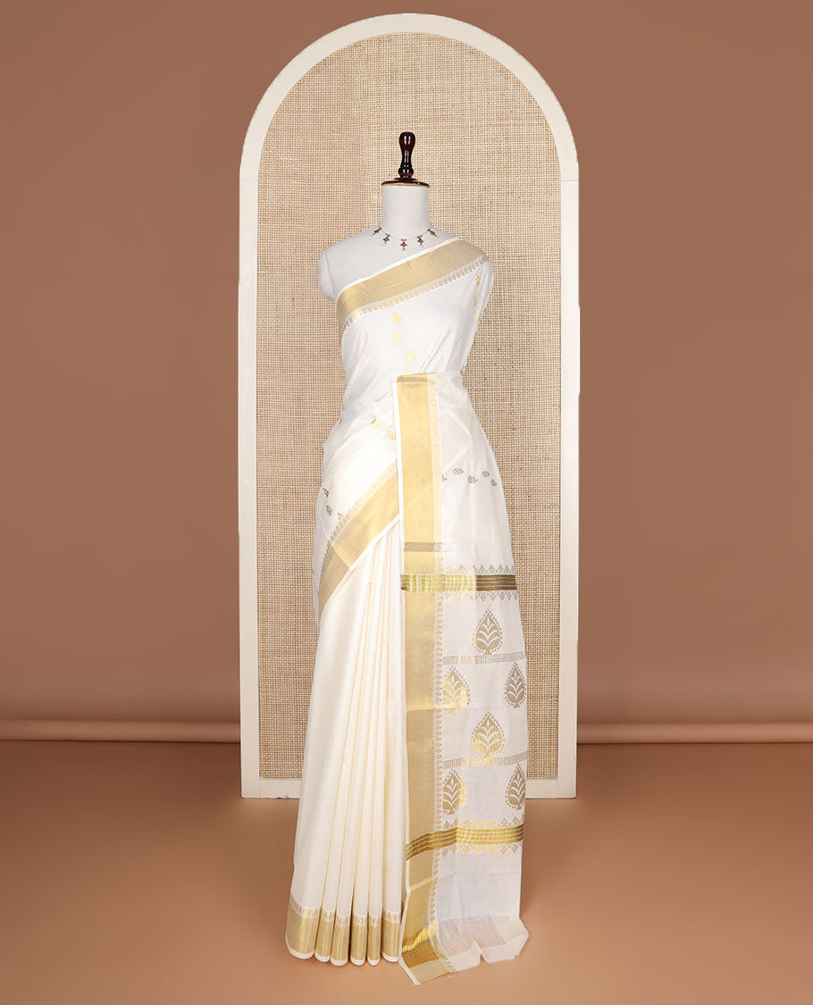 Cream zari buttas Kerala saree, zari border, and pallu of spade shape motifs