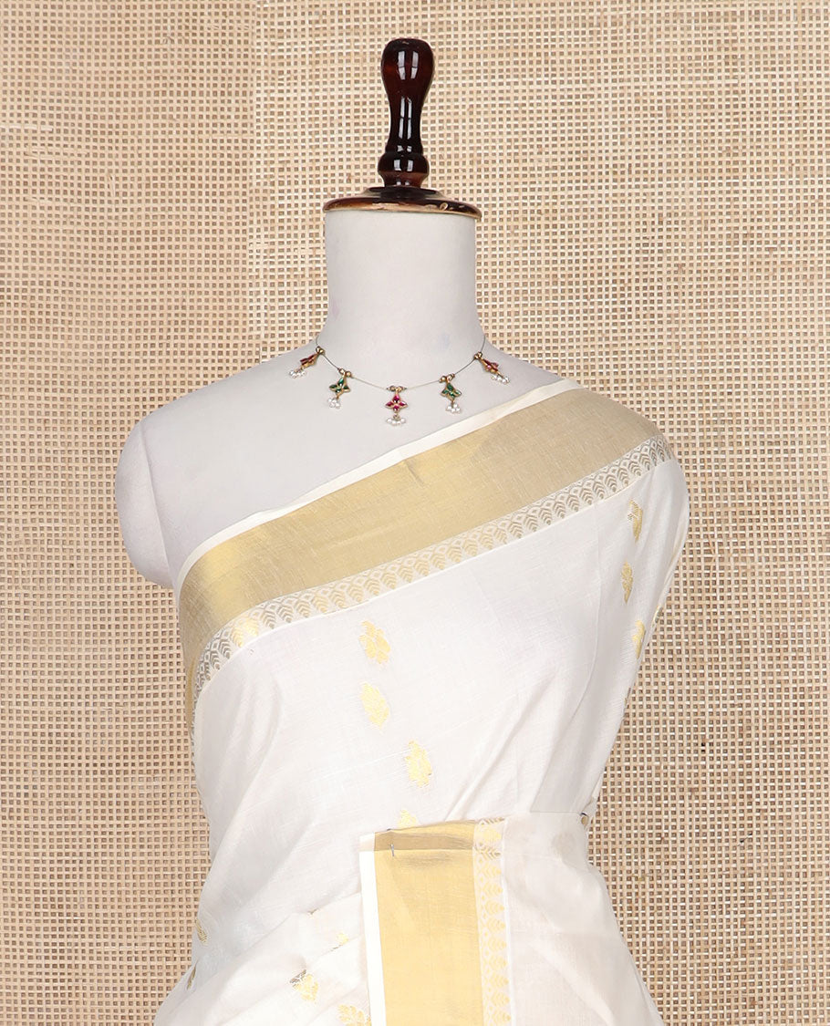 Cream zari buttas Kerala saree, zari border, and pallu of spade shape motifs