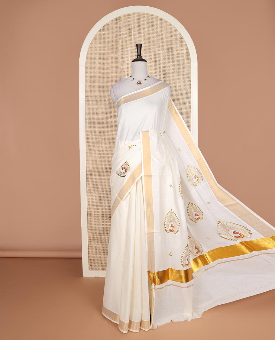 Cream peacock embroidered Kerala cotton saree, bavanji border, and pallu of peacock embroidery
