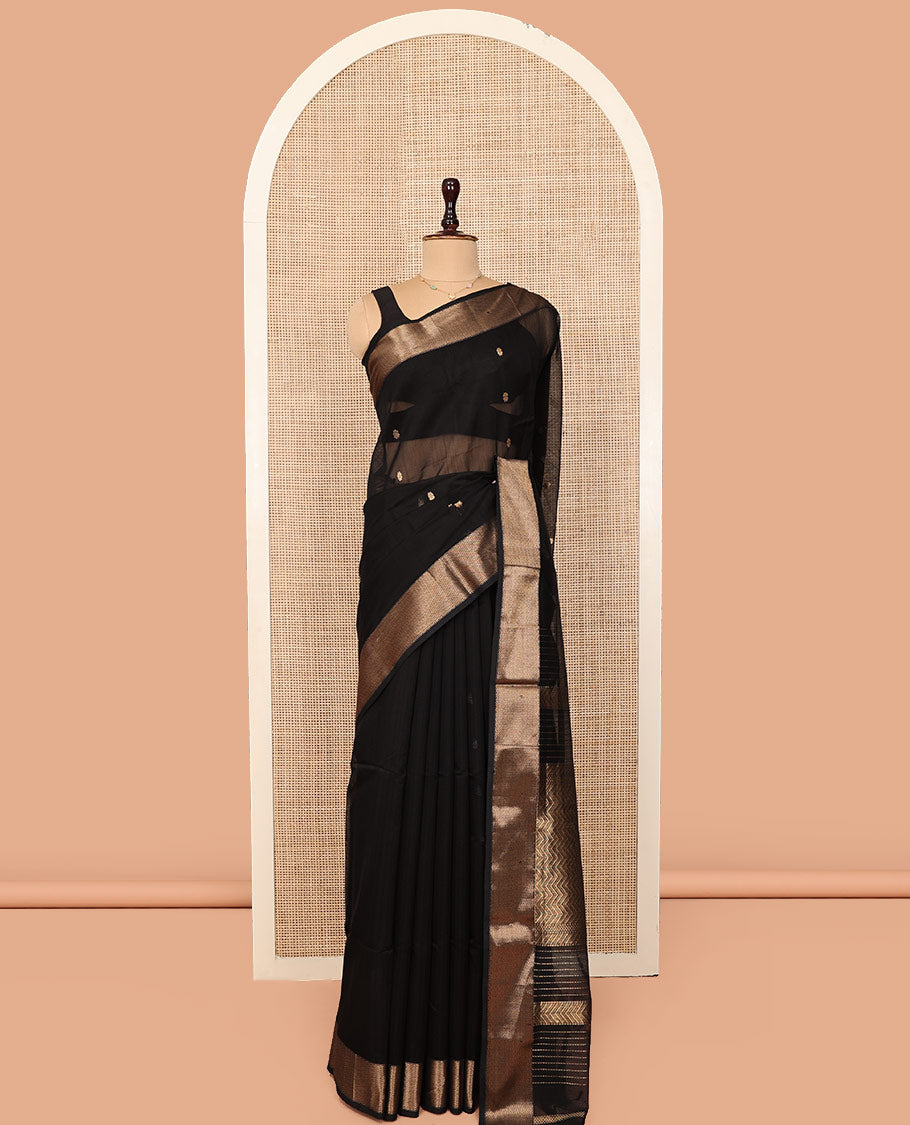 Black Maheshwari Cotton Saree, Spotlighted by Buttas All Over Its Body, Highlighted by a Traditional Zari Border of Chevron Stripes, Pallu of Chevron Stripes, and Paired with a Matching Blouse