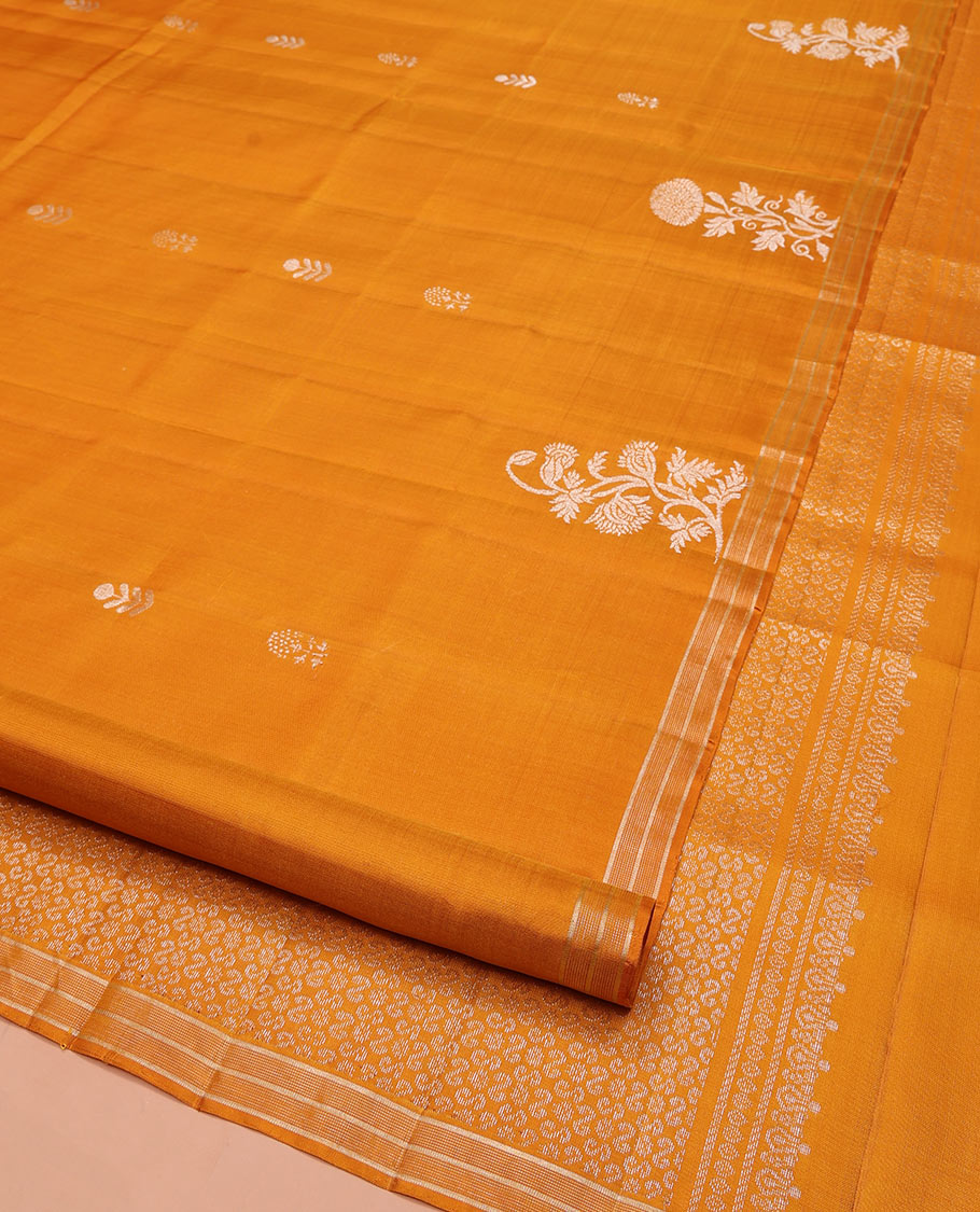 Orange Mayuri Soft Silk Saree, Elegantly Woven with Floral Zari Buttas on Its Body, Subtle Piping Border, Majestically Detailed Pallu, and Paired with a Matching Blouse