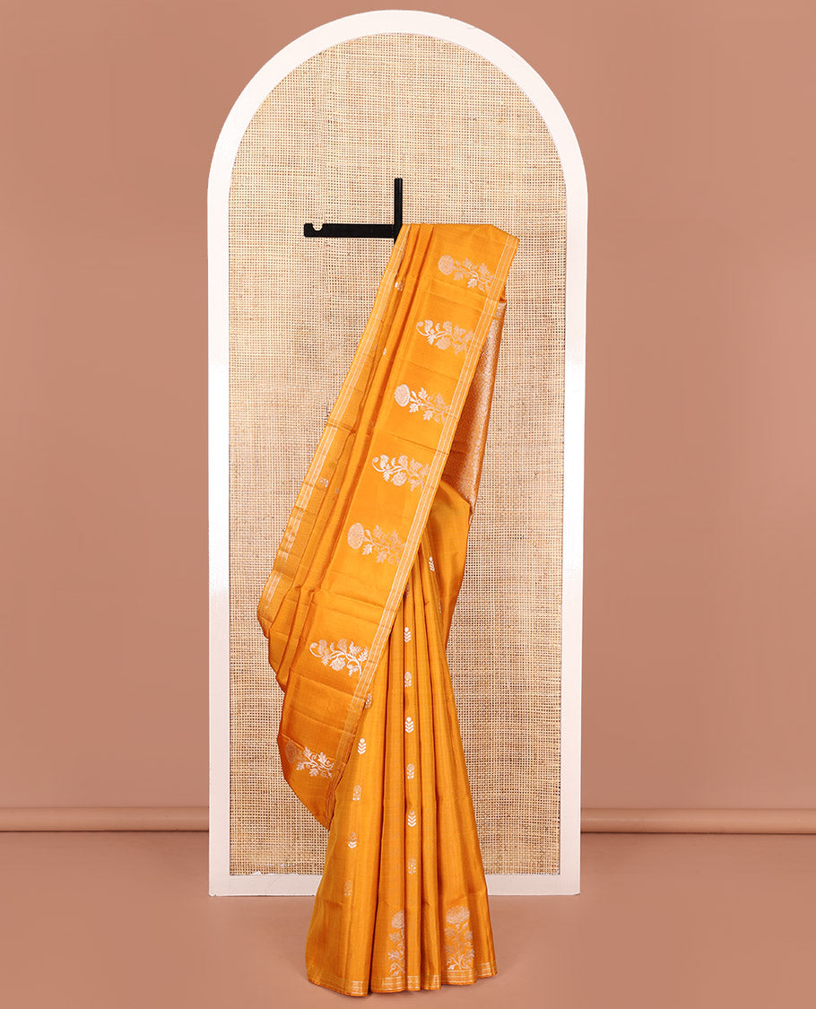 Orange Mayuri Soft Silk Saree, Elegantly Woven with Floral Zari Buttas on Its Body, Subtle Piping Border, Majestically Detailed Pallu, and Paired with a Matching Blouse