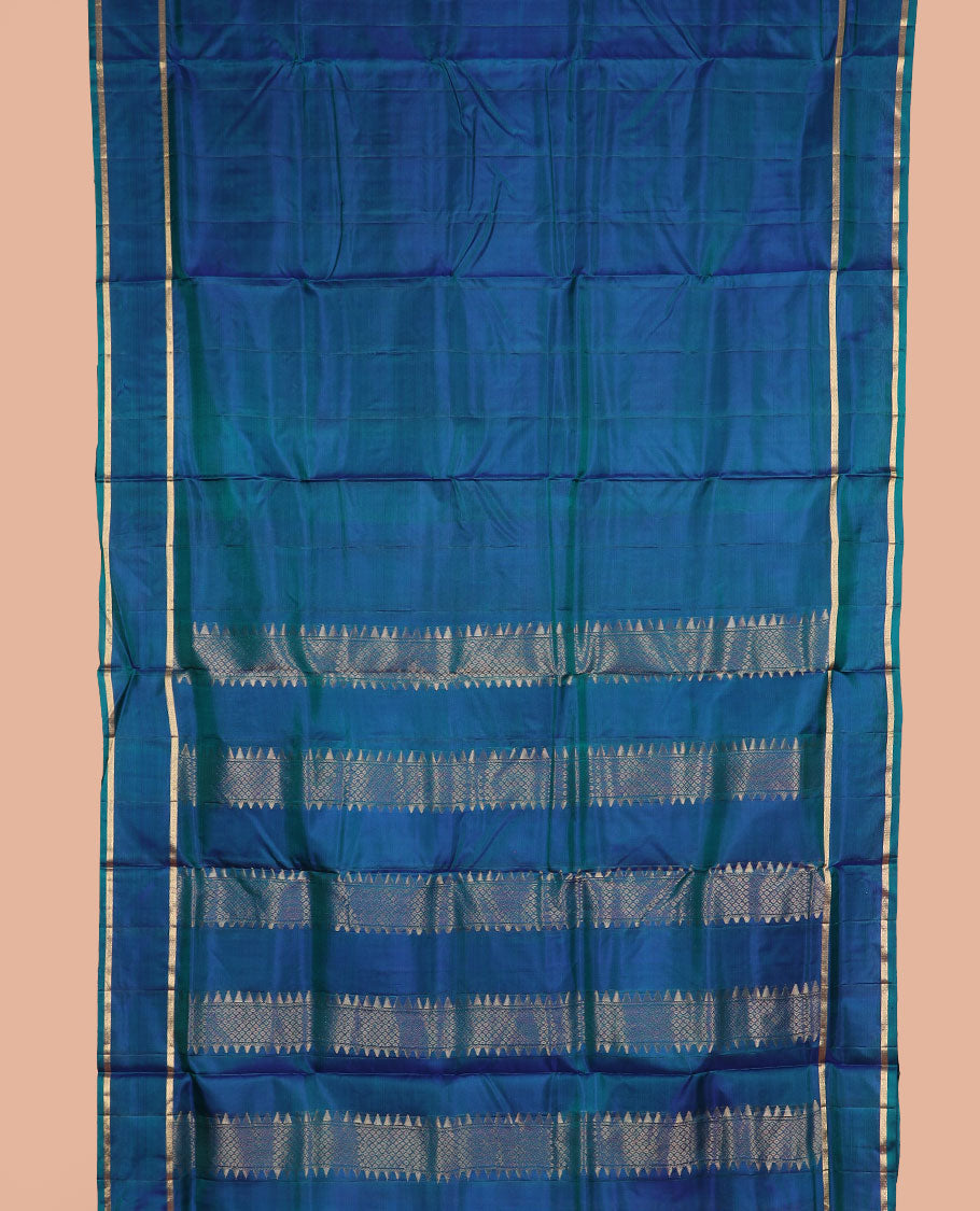 Blue plain nine-yard silk saree, rettai pettu zari mayil kann border, and pallu of rekku, and mayil kann designs