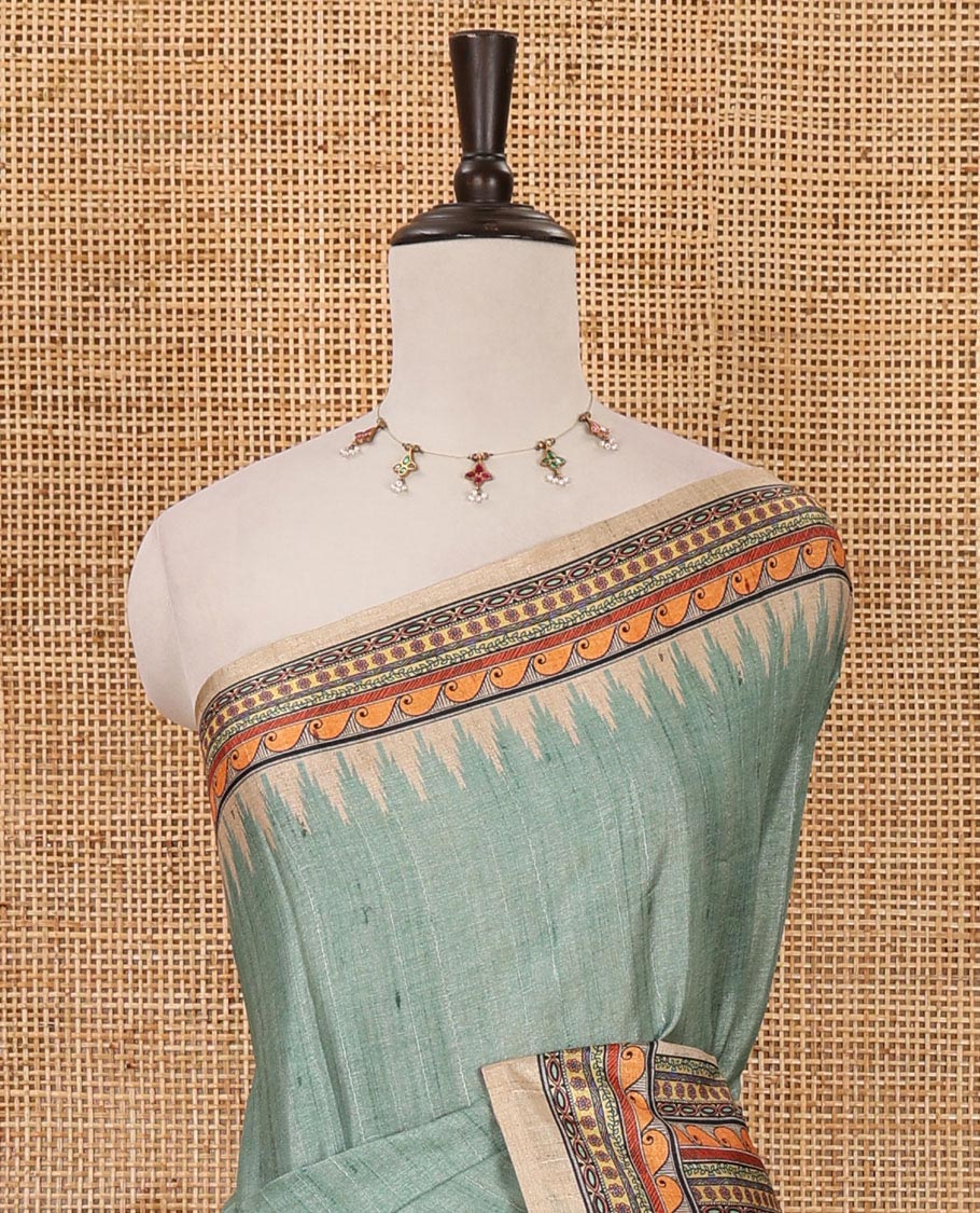 Green plain semi-tussar saree, contrast temple geometric printed border, kaleidoscope-colored Madhubani-style printed pallu & contrast plain blouse