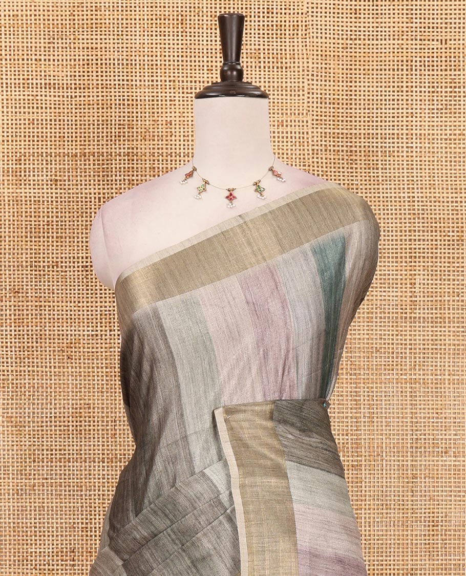 Green vertical stripes printed hand-brush dyed Katan silk saree, gold zari bavanji border, Madhubani-style human figurines printed pallu, and floral printed blouse