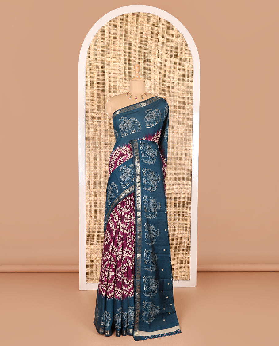 Purple shibori printed muslin cotton saree, contrast zari border of elephant motifs print, big elephant printed pallu, and a contrast printed blouse