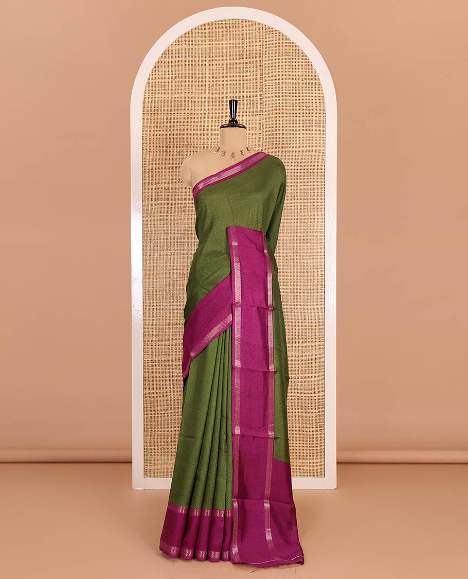 Olive green embossed moss chiffon saree, contrast traditional rettai pettu border, embossed pallu, and a contrast embossed blouse