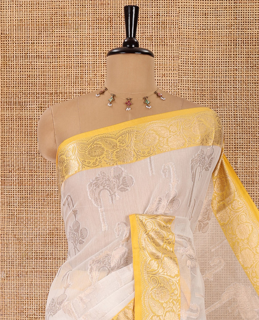 Cream floral motifs zari woven Chanderi cotton saree, contrast floral design zari border, jaal pallu, and a contrast jacquard blouse