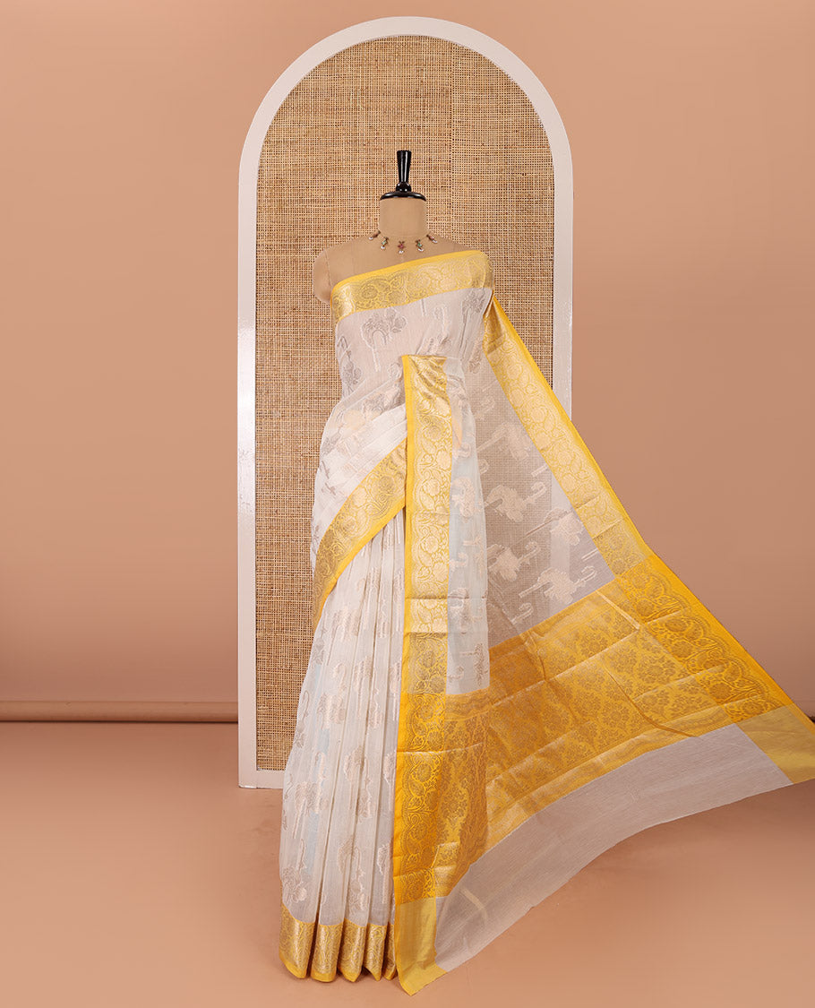 Cream floral motifs zari woven Chanderi cotton saree, contrast floral design zari border, jaal pallu, and a contrast jacquard blouse