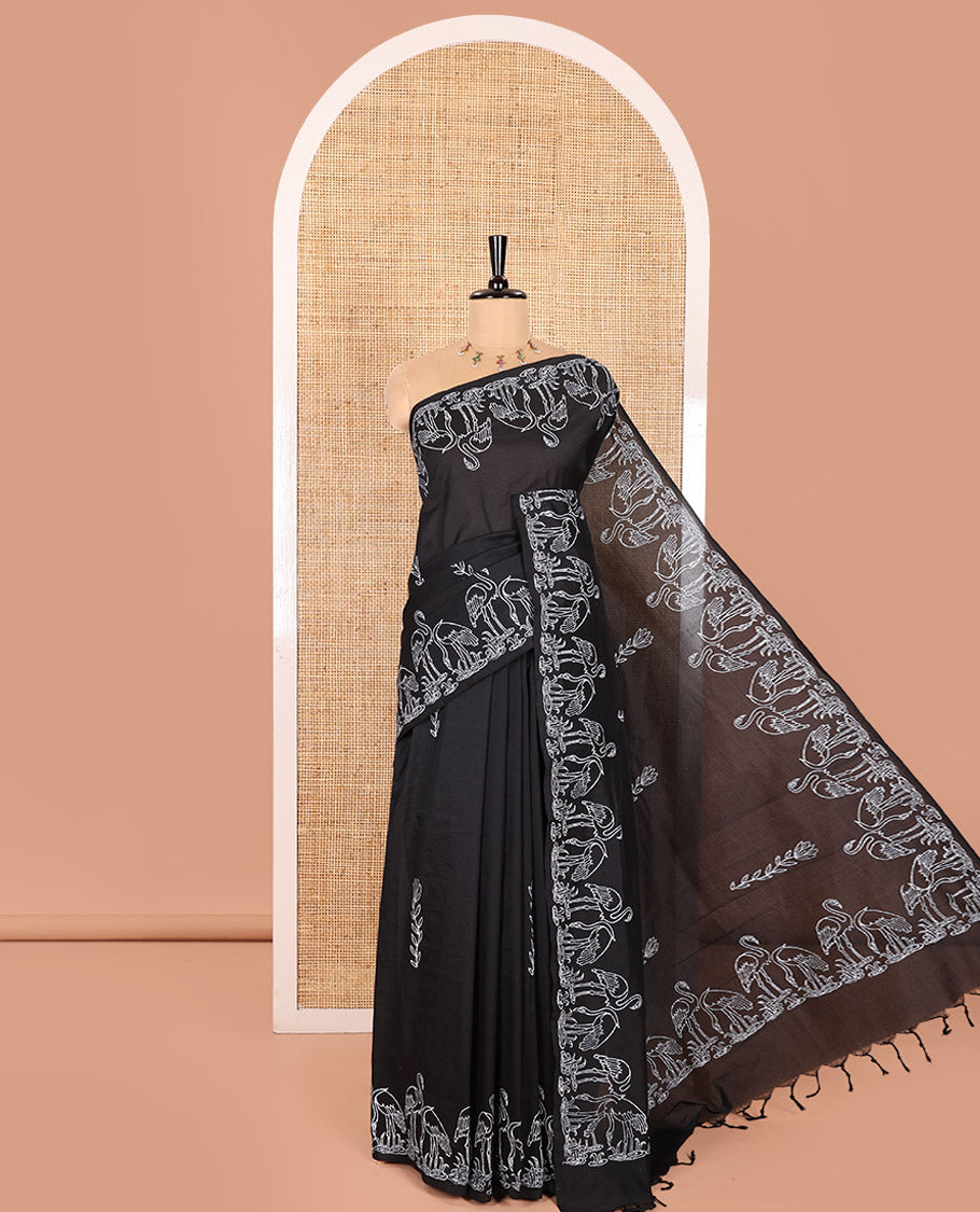 Black South Cotton Saree, Highlighted with Floral Motifs Printed All Over Its Body, Flamigo Motifs Printed Border, and Paired with One Matching Flamigo Printed Blouse, One Contrast Floral Motifs Block Printed Blouse