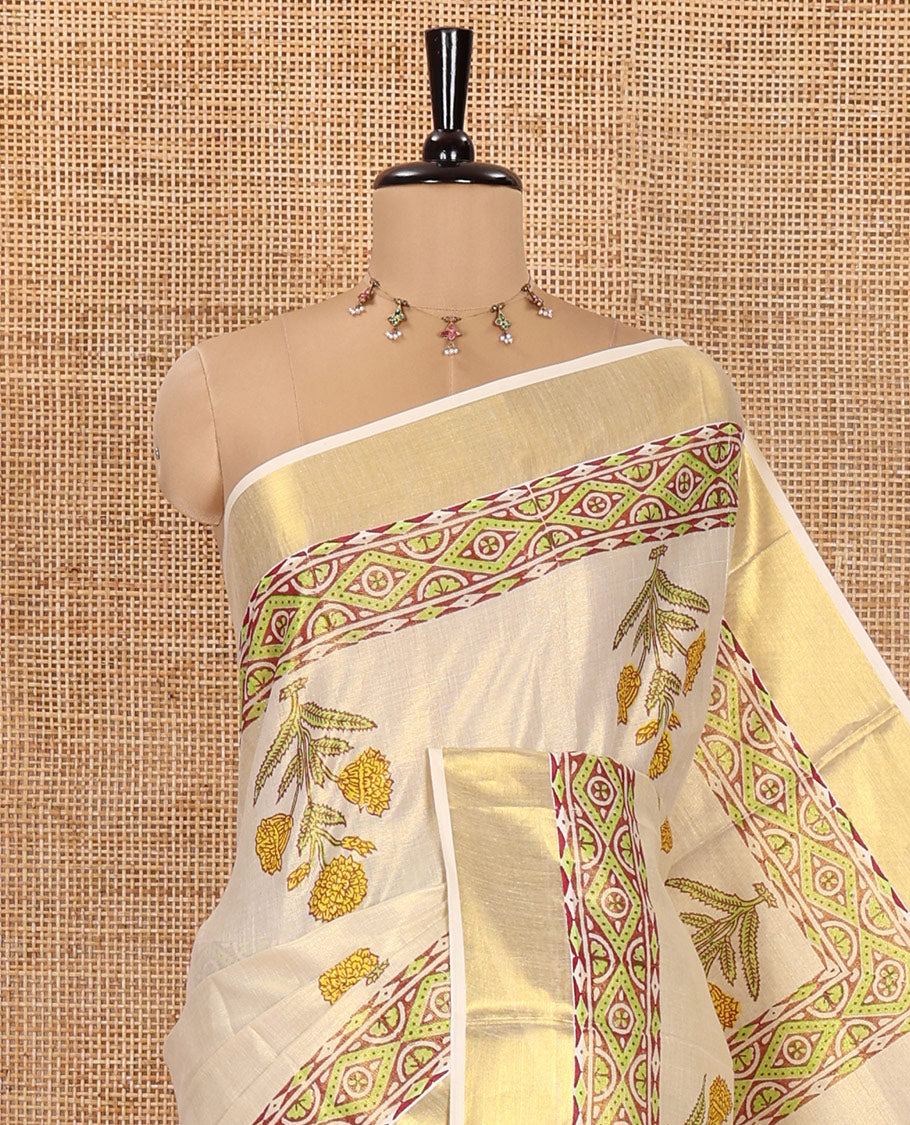 Gleaming Cream Kerala Tissue Saree, Enthralled with Floral Buttas Printed on Its Body, Highlighted by Golden Zari Border, Pallu Adorned with Floral Print, and Paired with a Printed Blouse