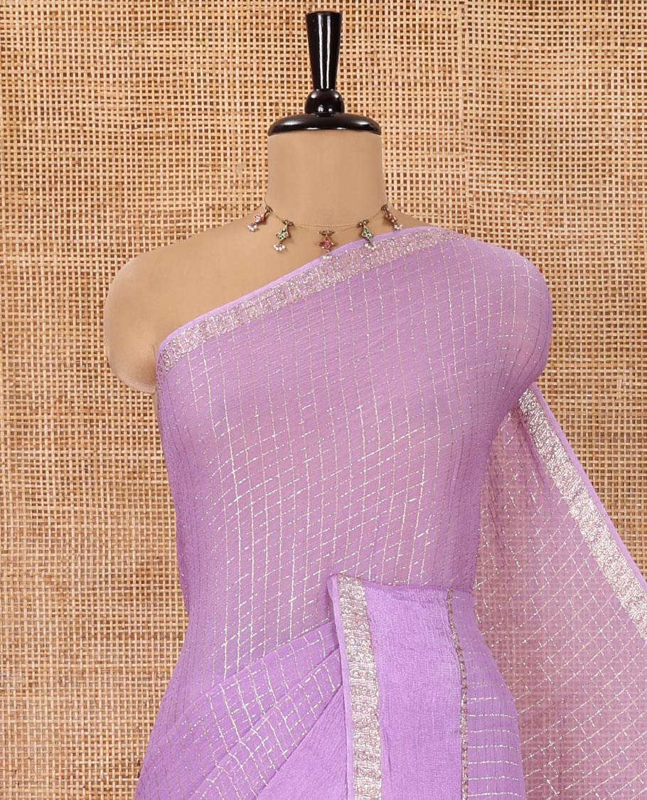 Scintillating Lavender Viscose Georgette Saree Gleamed Up with Checked Design on Its Body, Highlighted by a Double-Pet Border, Zari Checked Design Pallu, and Paired with a Matching Blouse
