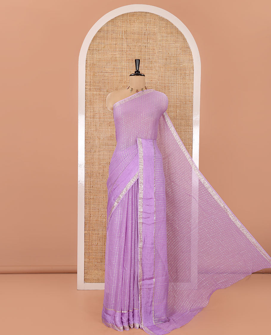 Scintillating Lavender Viscose Georgette Saree Gleamed Up with Checked Design on Its Body, Highlighted by a Double-Pet Border, Zari Checked Design Pallu, and Paired with a Matching Blouse