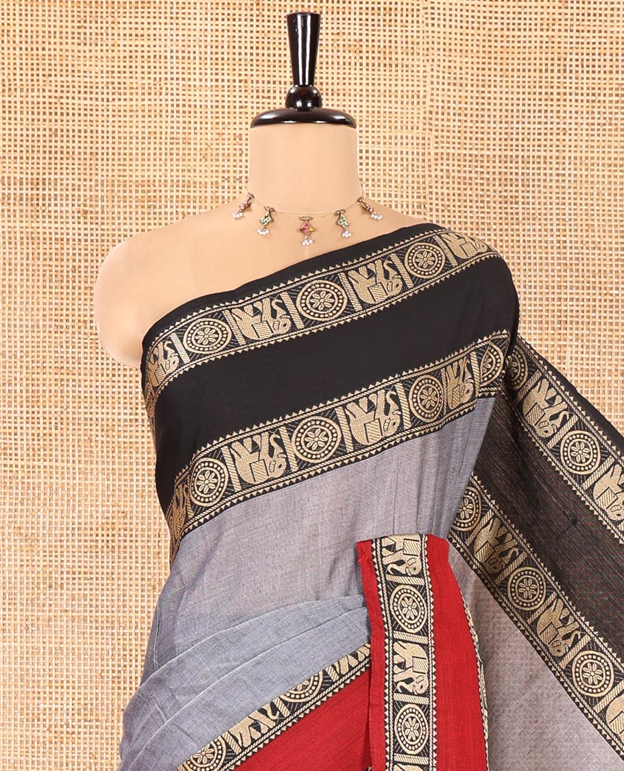Grey Plain Mercerised Cotton Saree, Complemented by a Contrast Ganga-Jamuna Rettai Pettu Thread Border of Temple, Elephant, and Chakram Designs, Subtly Striped Pallu, and Paired with a Matching Blouse