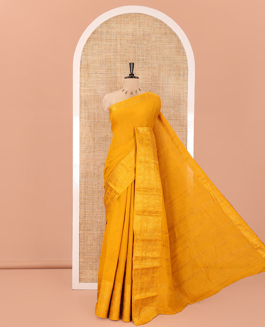 Mustard Plain Sungudi Cotton Saree, Highlighted by Traditional Zari Border of Peacock and Elephant Motifs Weave, Subtly Striped Pallu, and Paired with a Contrast Veldhari Design Blouse
