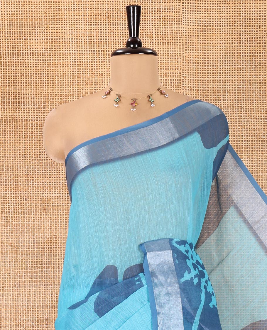 Blue Linen Cotton Saree, Prettified with Floral Print All Over Its Body, Complemented by a Contrast Zari Bavanji Border, Floral Printed Pallu, and Paired with a Matching Blouse