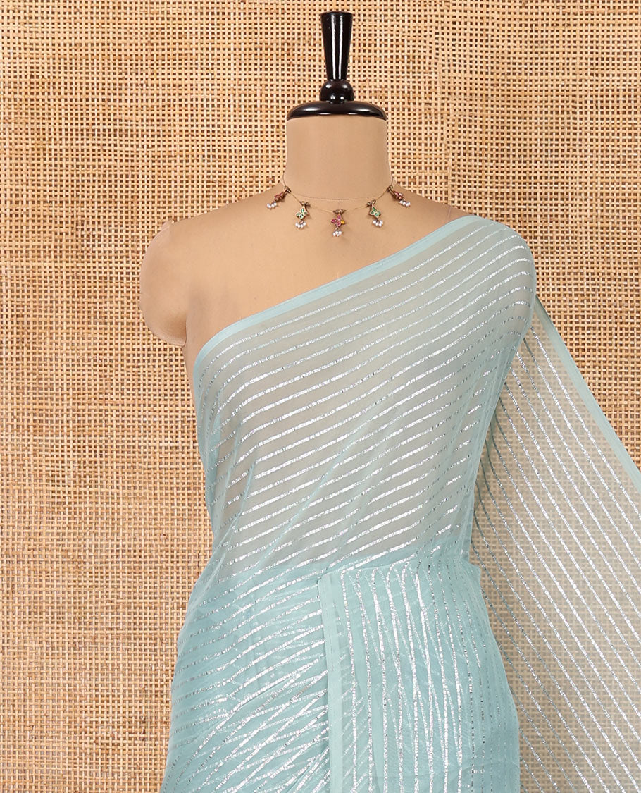 Borderless Sea Green Chiffon Saree, Gleamed Up with Horizontal Stripes on Its Body, a Self-Pallu, and Has No Blouse