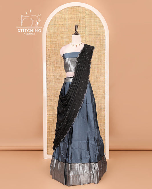 Grey-black taffeta silk half-saree, plain & contrast temple & kathir boder skirt, matching blouse & contrast stonework scallop border syska georgette dhavani
