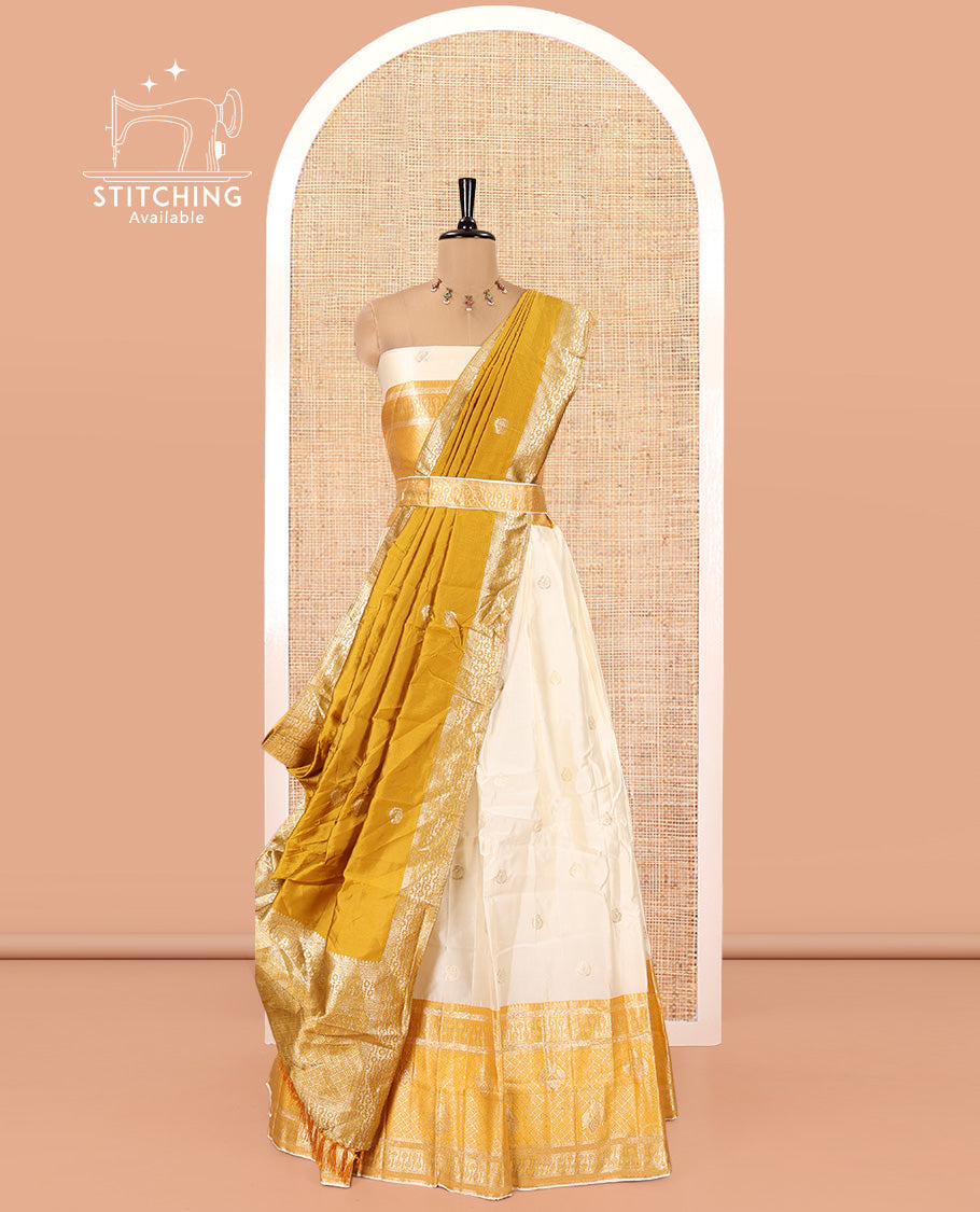 Cream-Yellow Semi-Banarasi Half-Saree Set Featuring Buttas Skirt, Contrast Traditional Border, Matching Blouse, and Banaras Dhavani