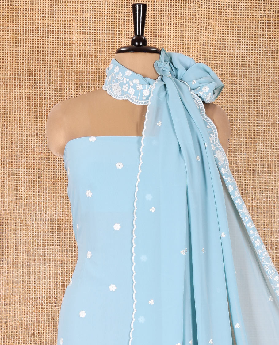 Blue Fox Georgette Material Chudidar Set, Gracefully Embellished with Floral Embroidery on Its Top, a Plain Santoon Bottom, and Paired with a Floral Embroidered Scallop Dupatta
