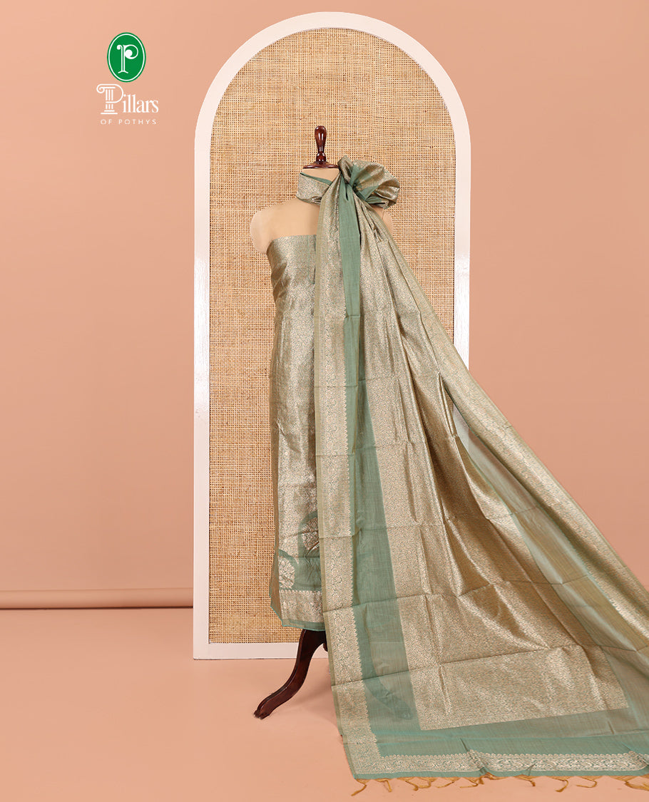 Green Banarasi Material Chudidar Features Jacquard Top, a Matching Santoon Bottom, and an Intricately Designed Dupatta