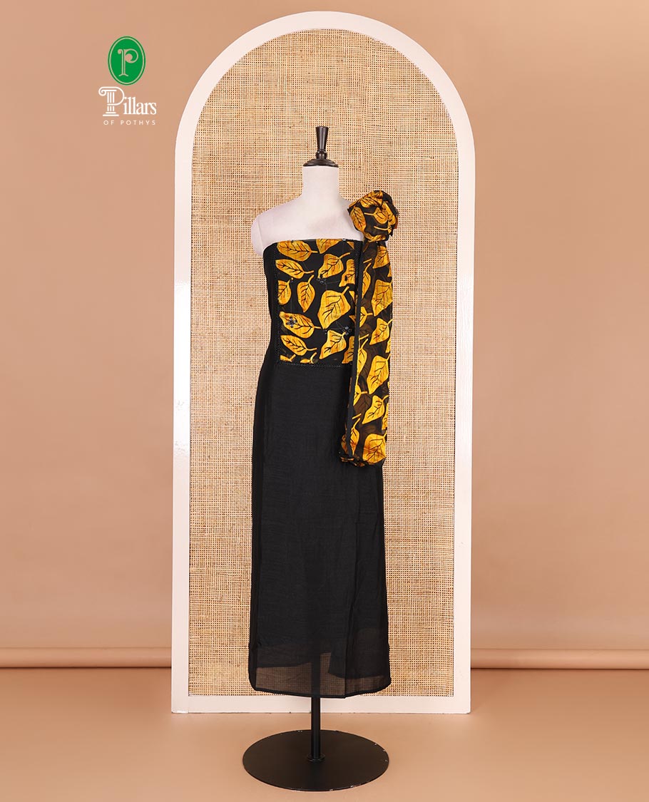 Black and yellow material churidar set, neck leaf print with mirror work Vichitra silk top, plain santoon bottom, and leaf printed shimmer georgette dupatta