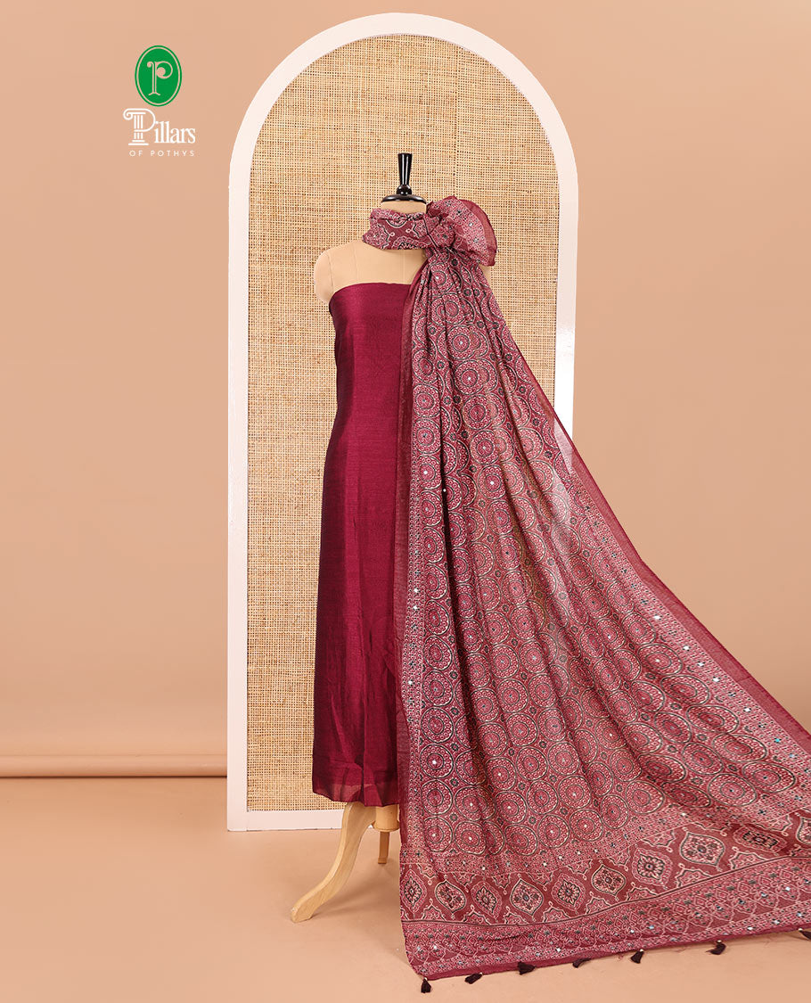 Magenta material chudidar set, plain Vichitra silk top, santoon bottom, and dupatta of Ajrakh print and mirror work