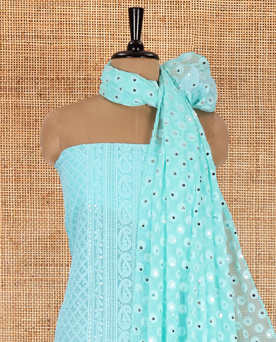 Persian green material chudidar set, paisleys and jaal schiffli sequins embroidered mul georgette top, a matching bottom, and a mirror work dupatta