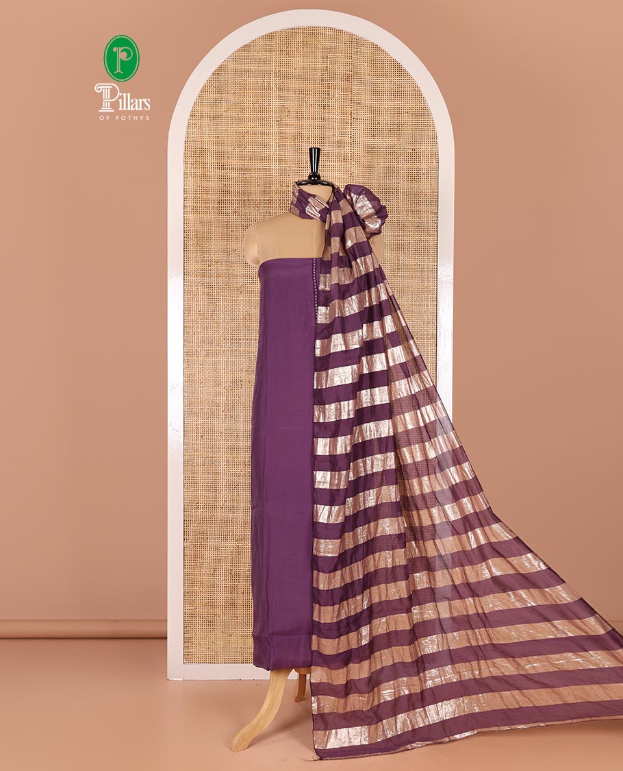 Lavender material chudidar set, plain with pom-pom tasseled mul chanderi top, a matching bottom, and organza dupatta of stripes