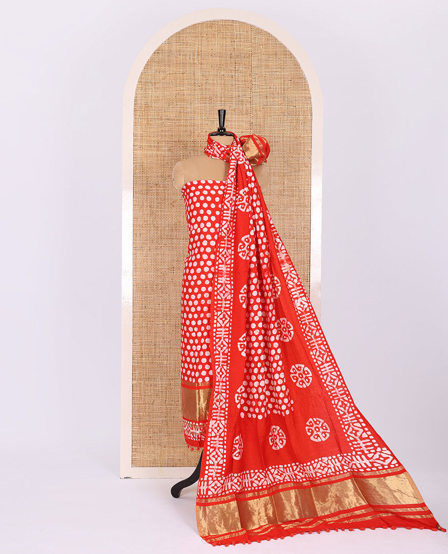 Chilli red material chudidar set, polka dots batik printed modal chanderi top, batik motifs printed bottom, and a batik motifs printed modal chanderi dupatta