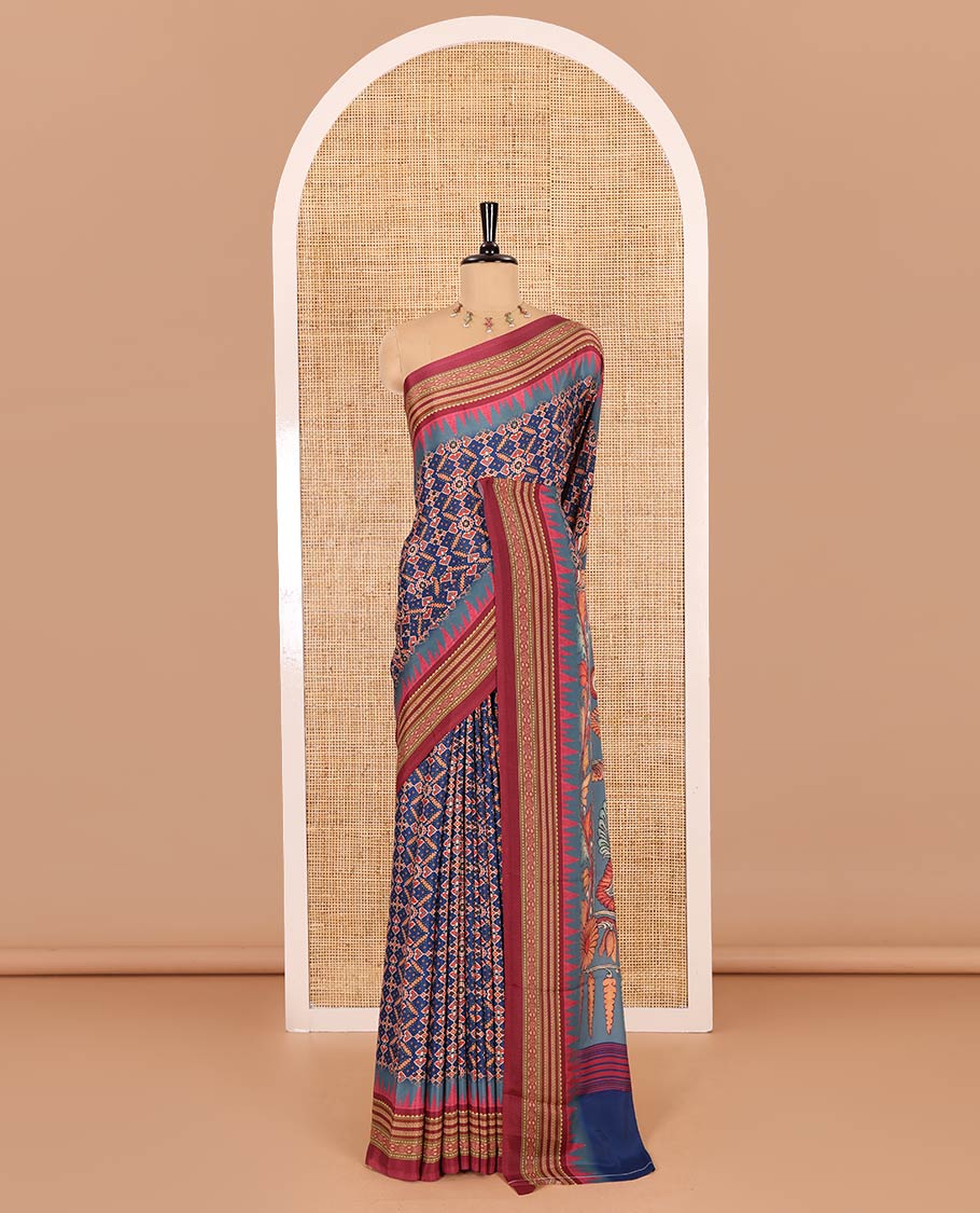 Blue patola style geometric printed Italian Crepe saree, contrast temple ikkat printed border, Kalamkari printed pallu, and a printed bordered blouse