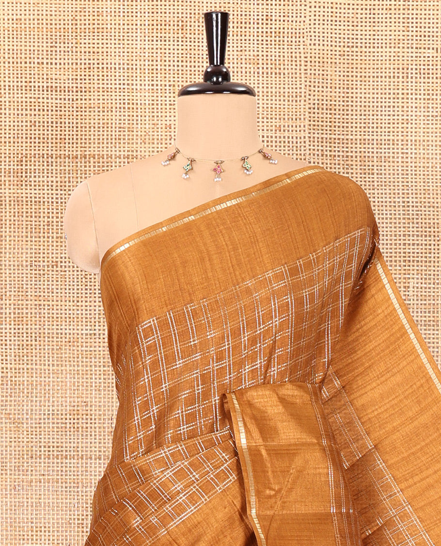 Golden brown zari checked fancy tussar silk saree, zari striped border, plain pallu, and a matching blouse