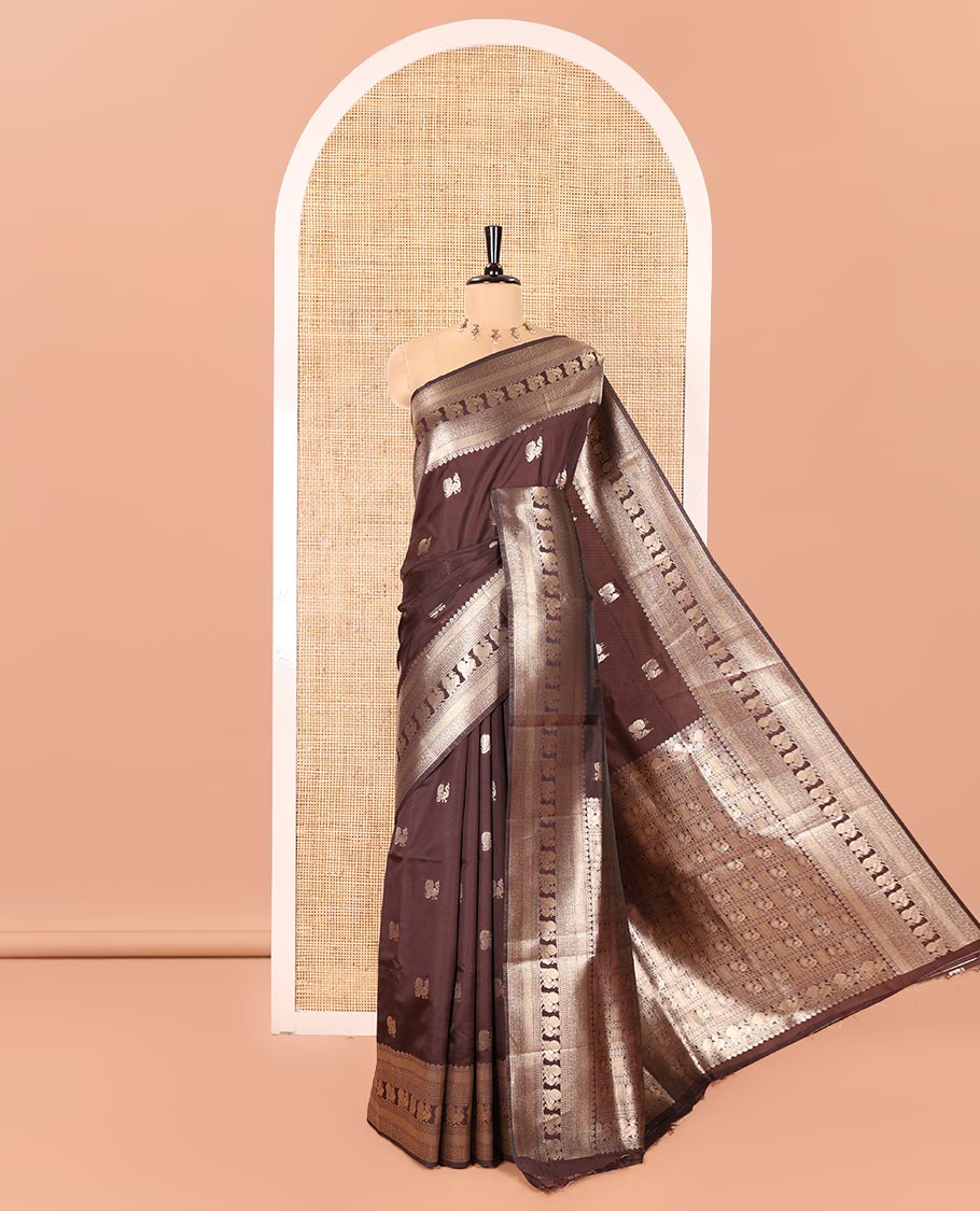Coffee Brown Litchi Silk Saree, Richly Detailed with Peacock Buttas All Over Its Body, Highlighted by a Traditional Zari Border of Peacock Designs, Grand Pallu of Butta Enclosed Zari Checks, and Paired with a Matching Blouse